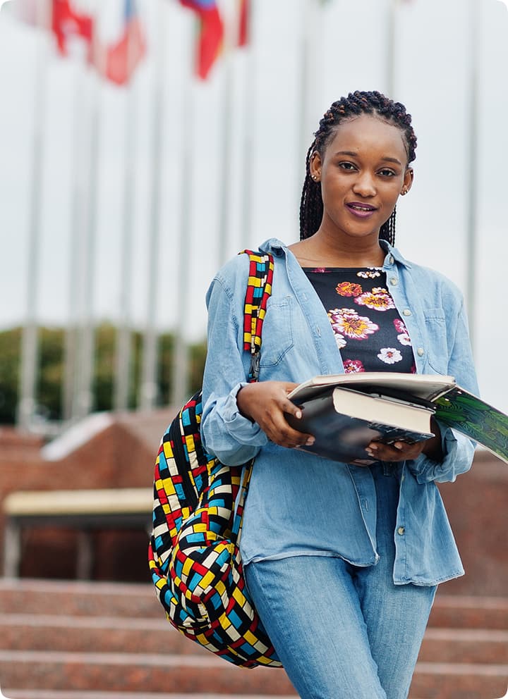 Africa female student posed with backpack and books